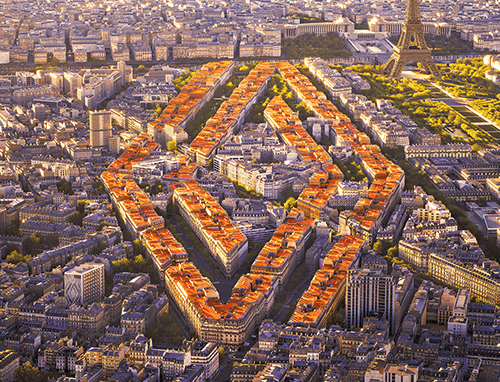 Birdseye view a city with houses making the shape of the Renault Logo