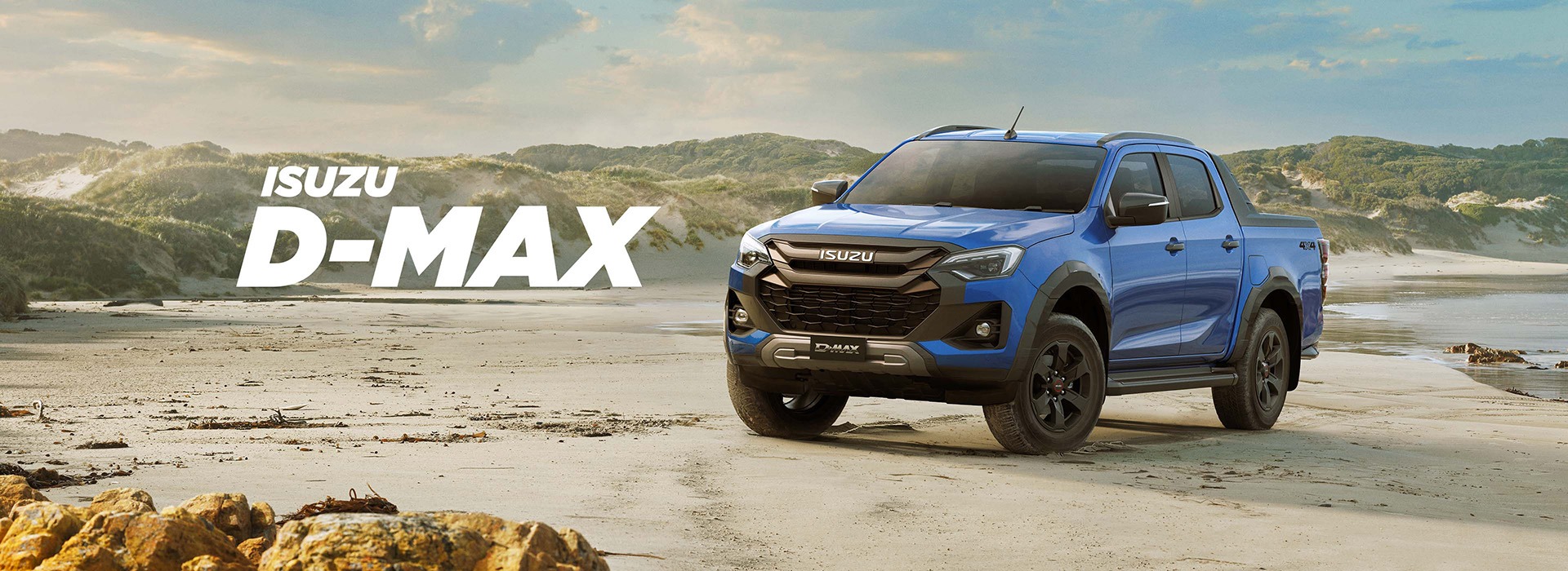 Blue Isuzu D-MAX on the beach