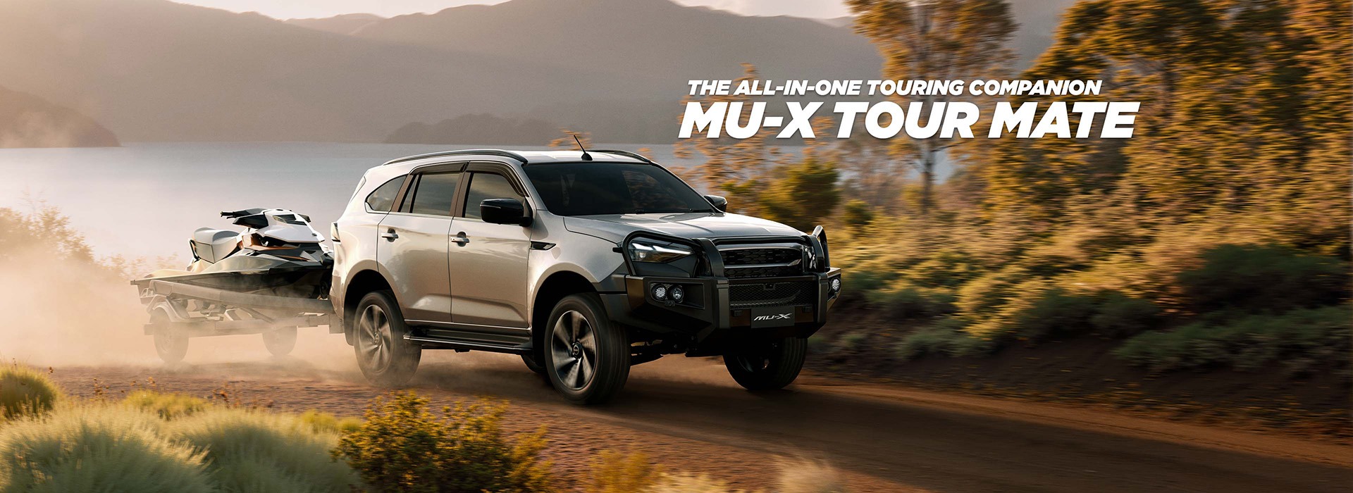 Isuzu UTE MU-X driving on dirt road