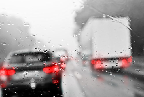 Cars in traffic while its raining
