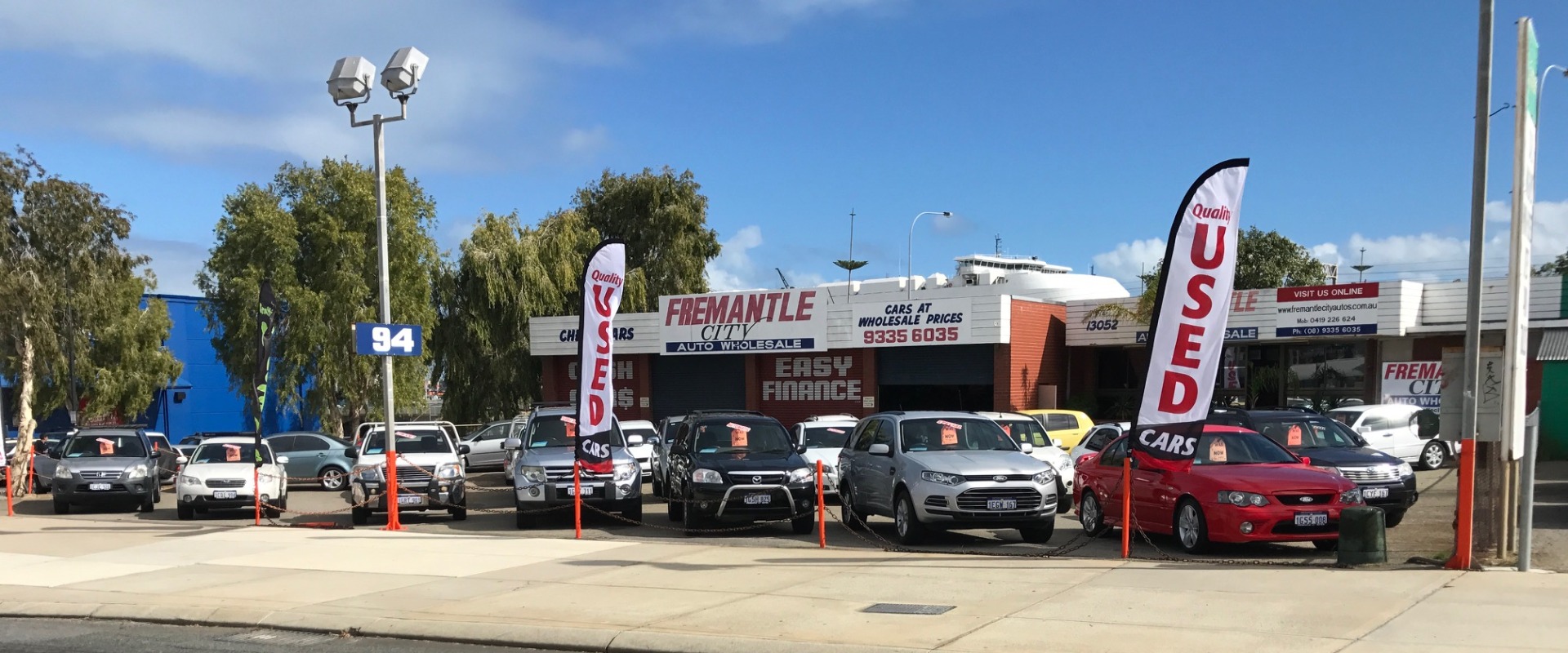 Woman purchasing a car with keys in her hand.