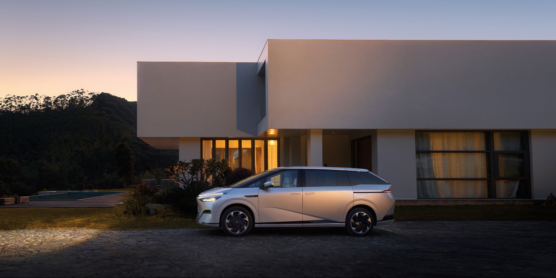 XPENG X9 parked infront of a house