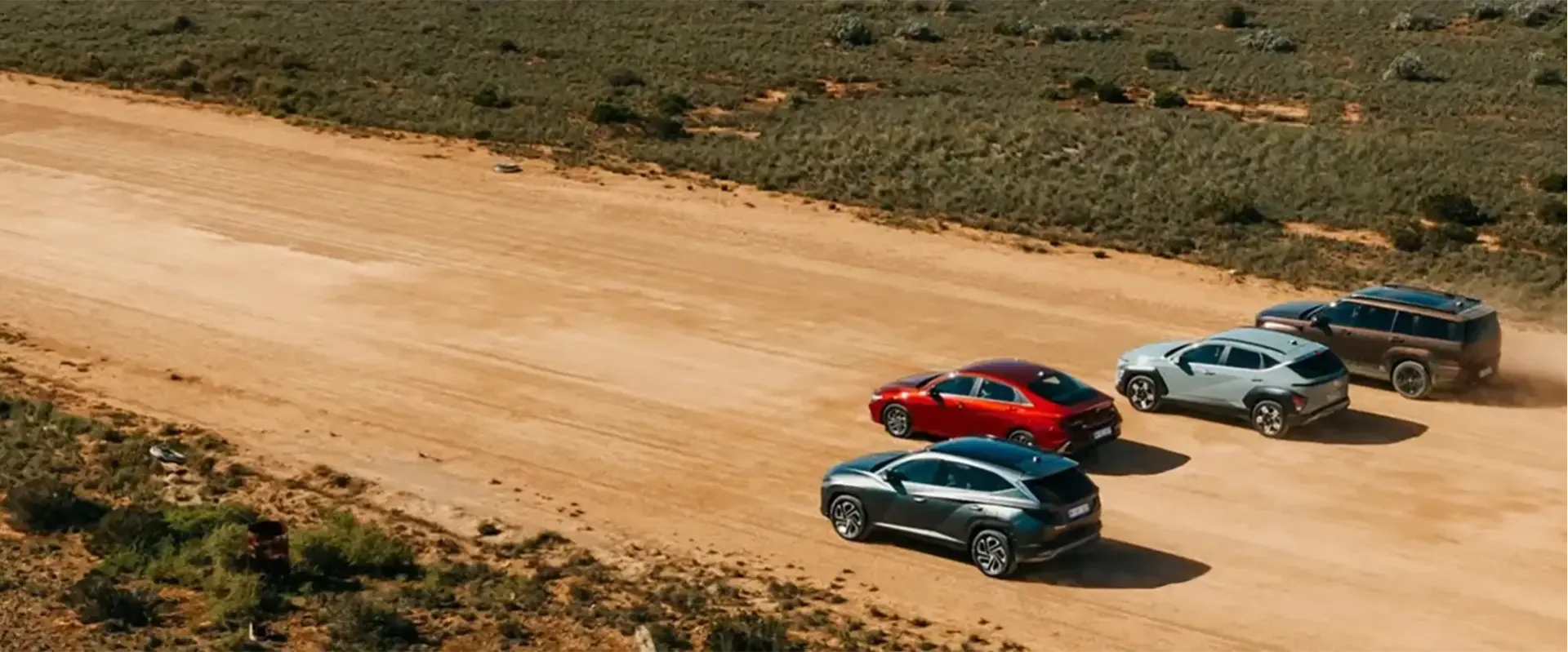Hyundai cars driving on dirt road