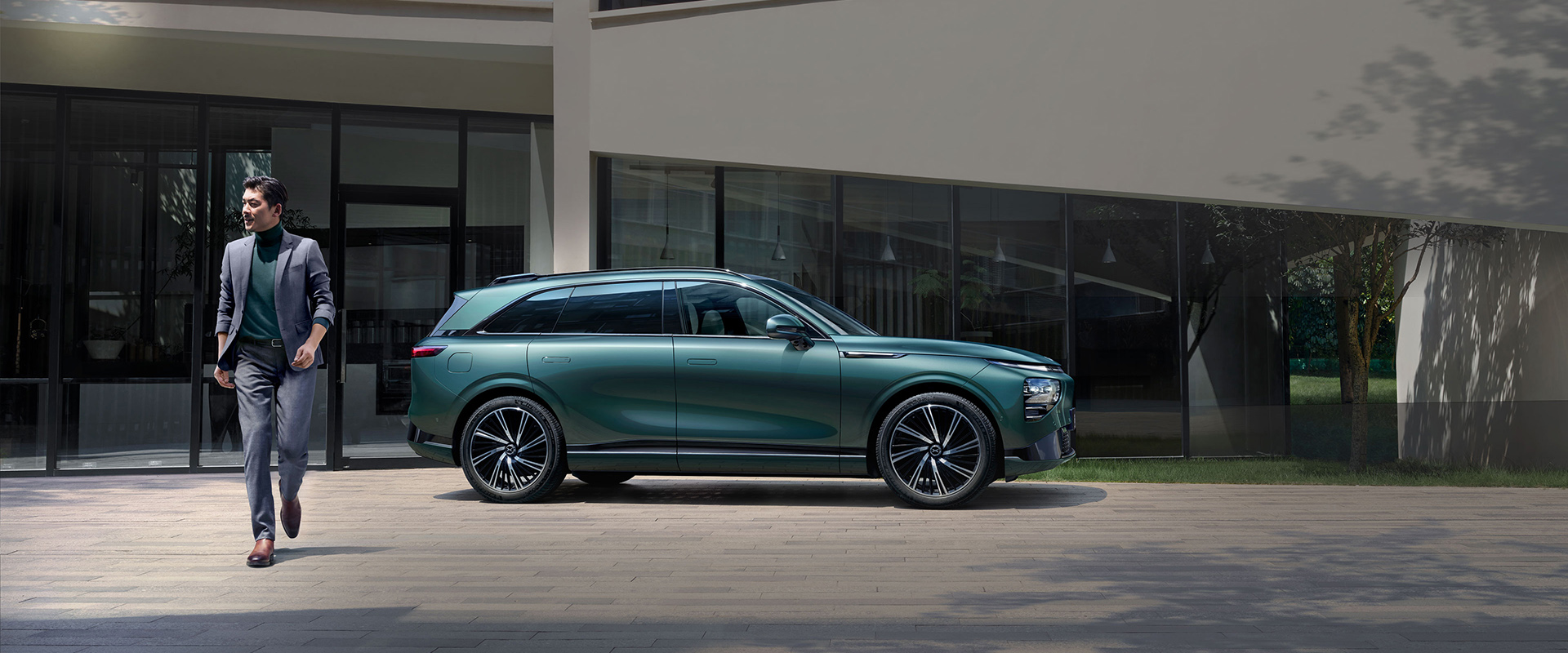 Man walking away from the XPENG G9
