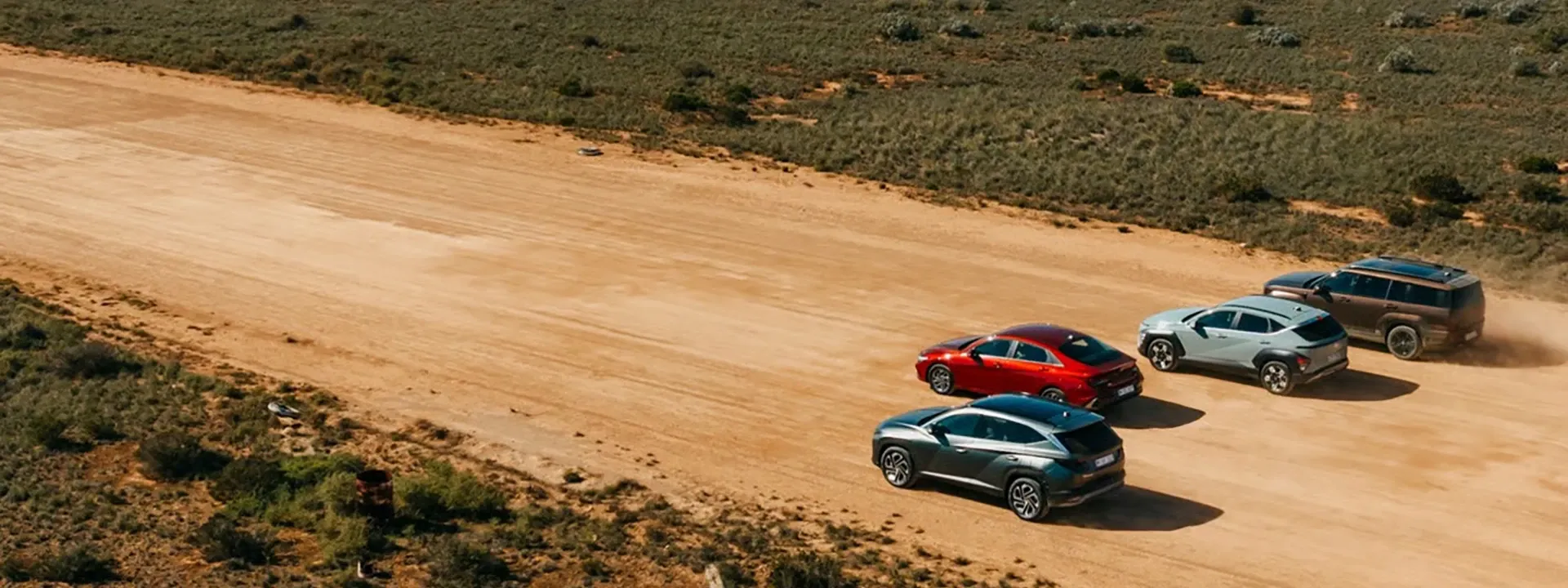 Hyundai vehicles driving on dirt road